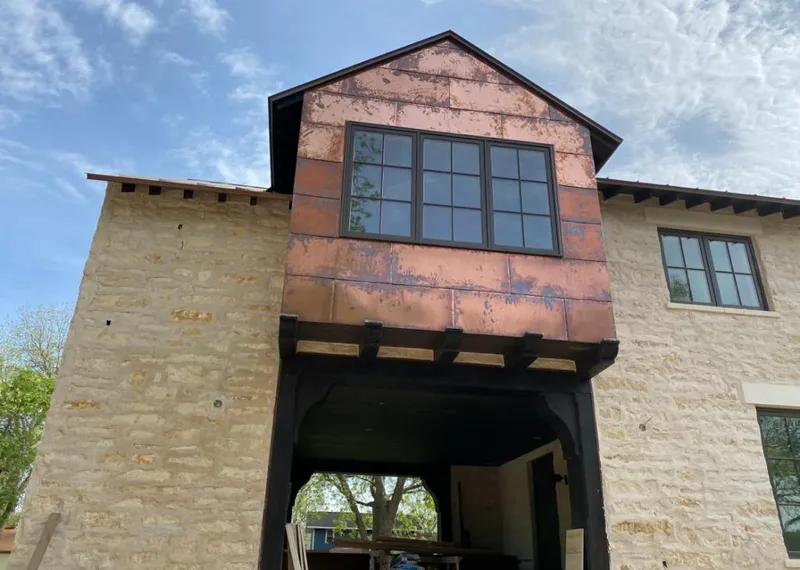 Copper metal panel facade on a stone building for Metal Roof Coating in Kailua-Kona