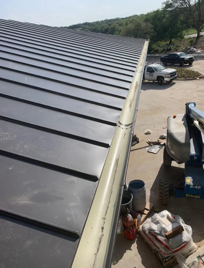 Standing seam panel and gutter detail on a metal roofing jobsite in Kailua-Kona
